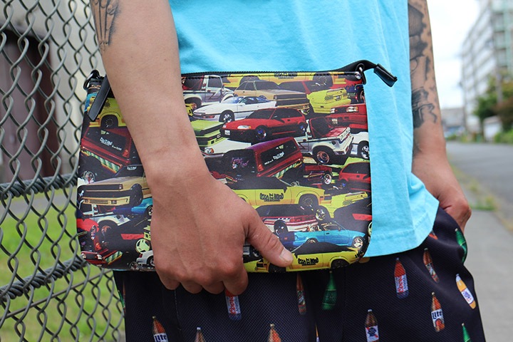 OSSANTHEHOOD clutch bag / multi