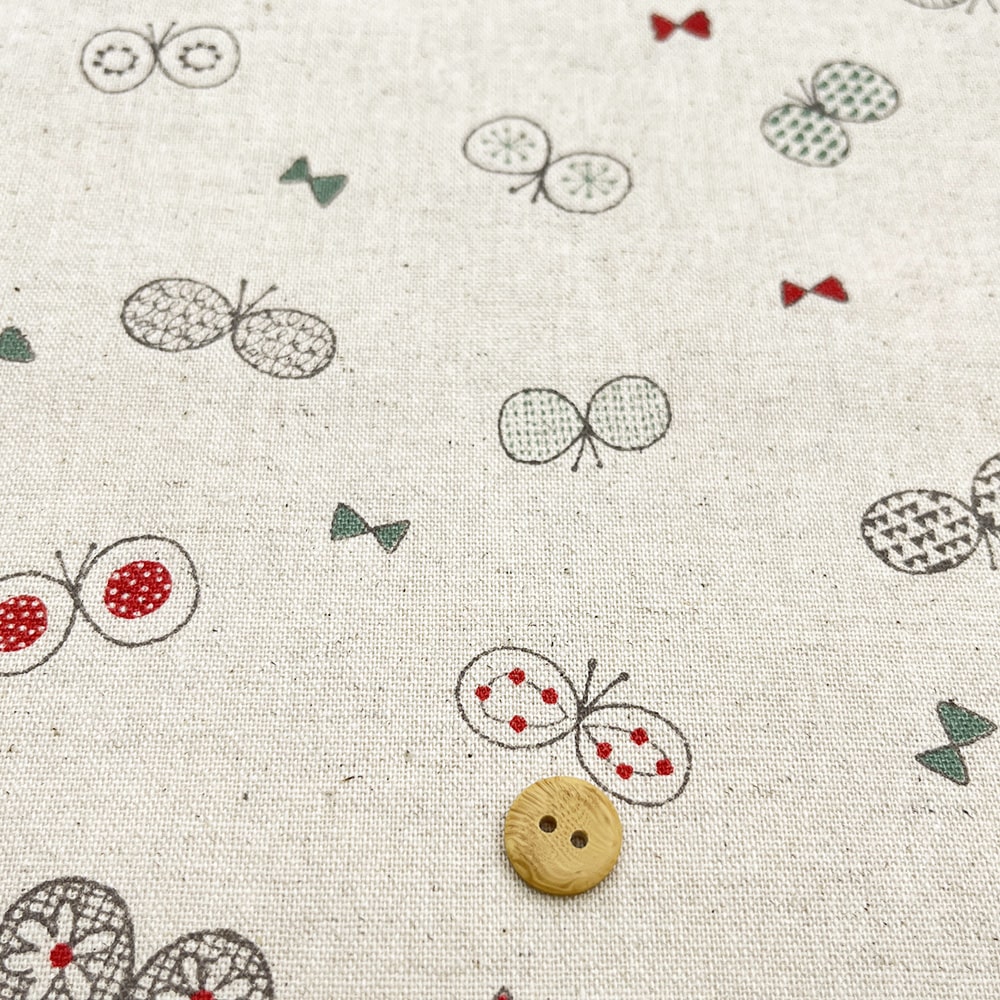 【sale】コットンリネンキャンバス｜ちょうちょとリボン プリント｜綿麻 ちょうちょ（ナチュラル)