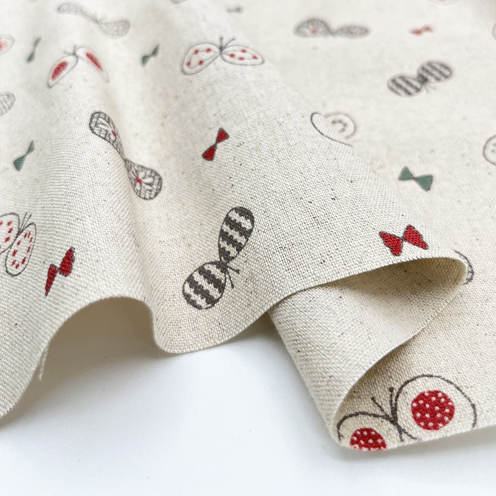 【sale】コットンリネンキャンバス｜ちょうちょとリボン プリント｜綿麻 ちょうちょ（ナチュラル)