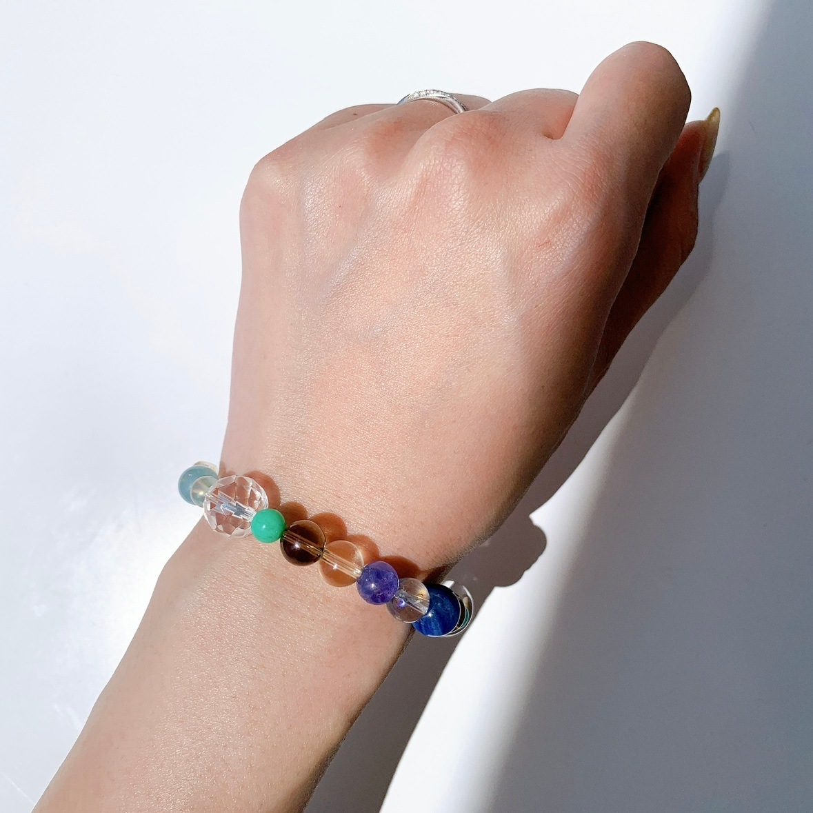 [111Y]カイヤナイト,スモーキークォーツ,ダイオプテーズ,ミルキークォーツ,水晶,レモンオーラ,レモンクォーツ,アマゾナイト,タンザナイト,クリソプレーズ,アクアマリン,コスモオーラ ブレスレット