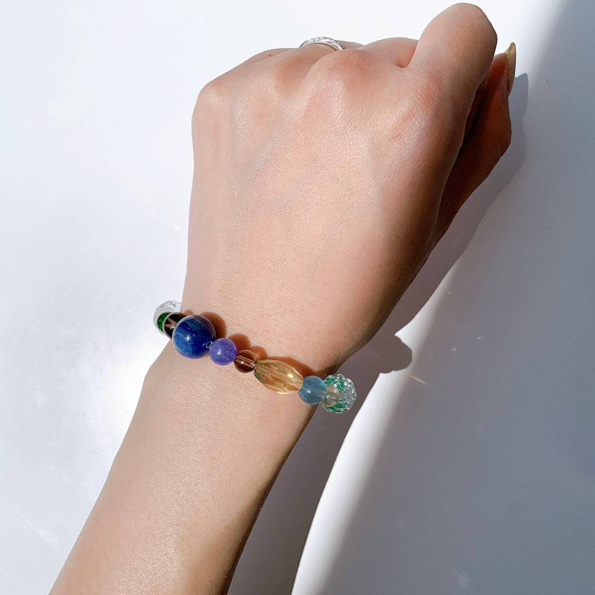 [111Y]カイヤナイト,スモーキークォーツ,ダイオプテーズ,ミルキークォーツ,水晶,レモンオーラ,レモンクォーツ,アマゾナイト,タンザナイト,クリソプレーズ,アクアマリン,コスモオーラ ブレスレット