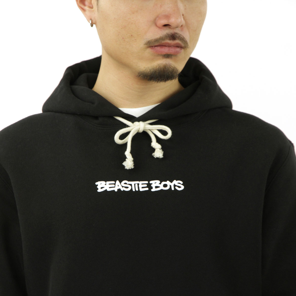 �����ԥ��� ��� �ѡ����� ������ CHAMPION �ӡ����ƥ����ܡ����� �ץ륪���С� �ա��ǥ��� CHAMPION X BEASTIE BOYS TCV REVERSE WEAVE SOFT FLEECE "CHECK YOUR HEAD" HOODED SWEATSHIRT 219279 KK001 NBK BLACK