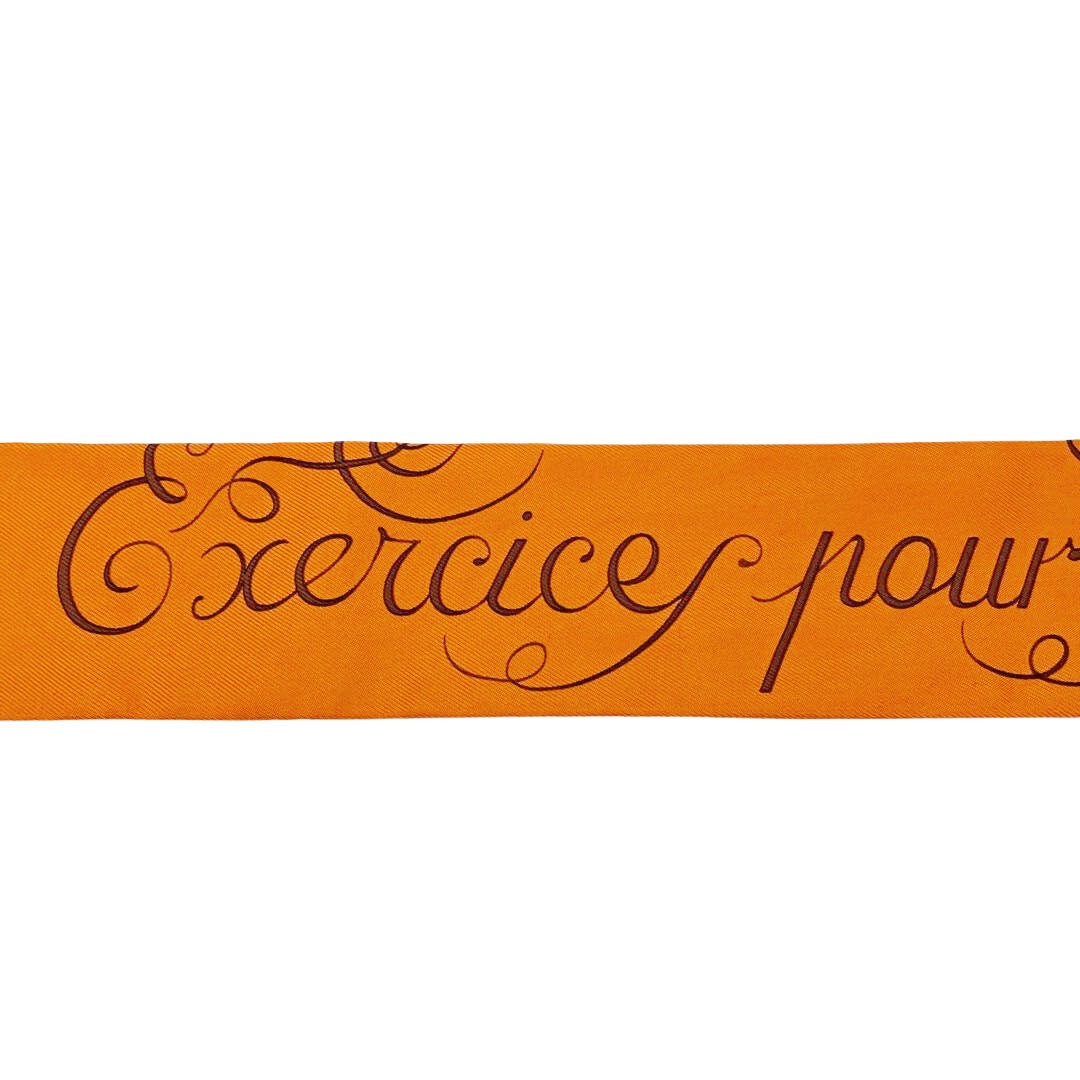 HERMES エルメス スカーフ ツイリー 『Exercice pour foumer la main(手を差しのべる)』 シルク オレンジ