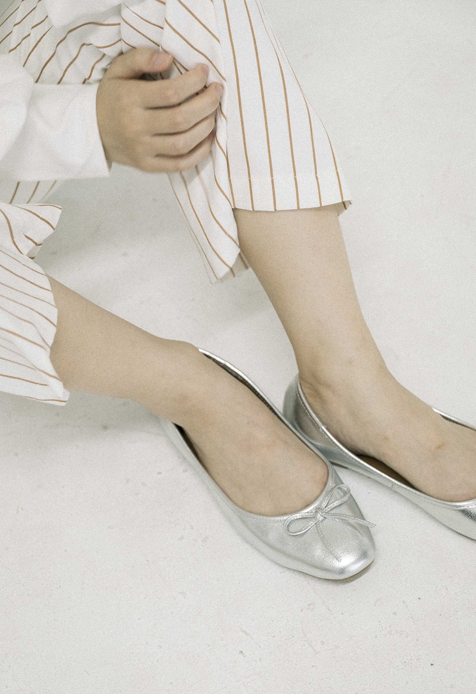 beige striped flared pants