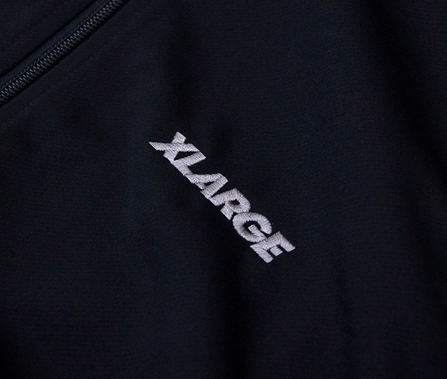 XLARGE �������ȥ�顼�� ��� OG �ȥ�å����㥱�åȡ�101253021005�ϡ�2025FW��