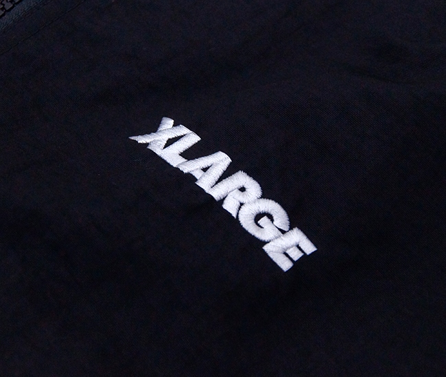 XLARGE �������ȥ�顼�� ��� �ȥ�å��ʥ����󥸥㥱�åȡ�101253021008�ϡ�2025FW��