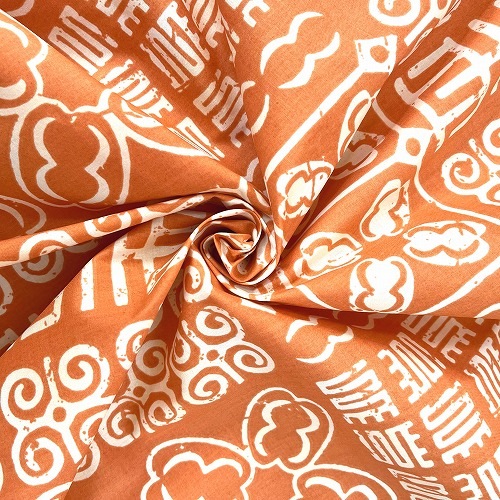 アフリカンプリント生地 0.5m単位 AP-12981　ハワイアンなアディンクラ 淡いオレンジ