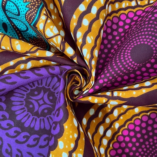 アフリカンプリント生地 50cm単位 AP-13184　蝶々 水紋 波紋 茶系地ピンク紫ブルグリーン	