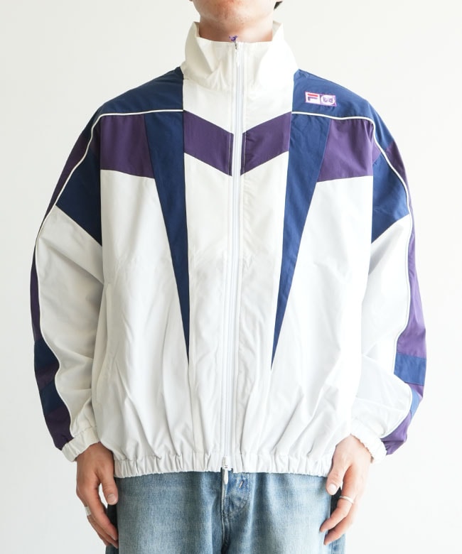 NEEDLES(ニードルズ) × FILA(フィラ) Star Cut Over Sized Windbreaker
