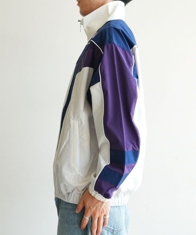 NEEDLES(ニードルズ) × FILA(フィラ) Star Cut Over Sized Windbreaker