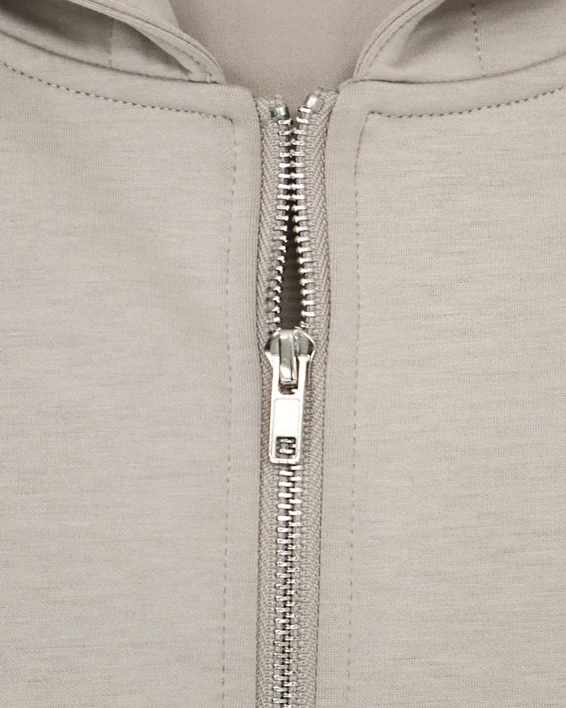 ダンボールポンチ裾ドロスト入りフーディーブルゾン